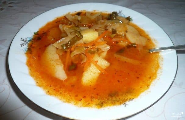 Sour cabbage soup with chicken broth