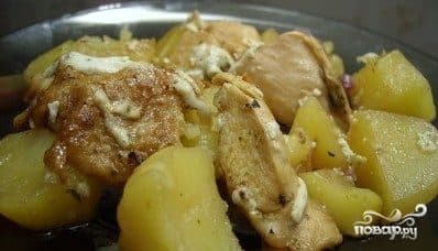 Chicken with potatoes in foil