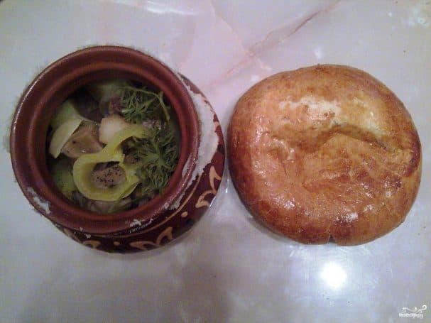 Meat in pots with dough