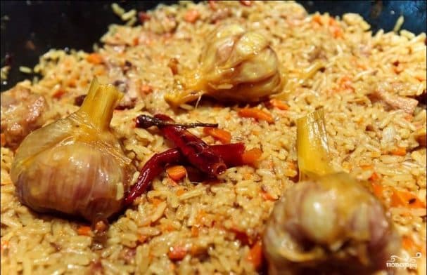 Plov cooked over an open fire