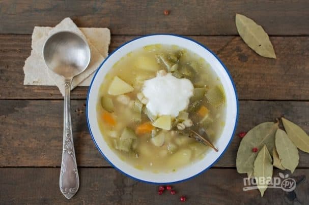 Vegetable soup with pickled cucumbers in vegetable broth