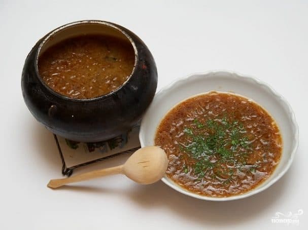 Cabbage soup in a cast-iron pot