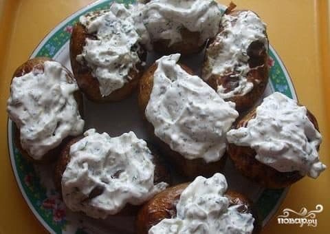 Baked potatoes in foil in the oven