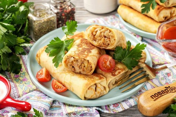 Pancakes with meat, carrots, and cabbage