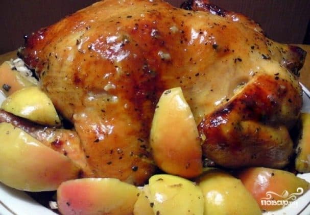 Chicken stuffed with apples, baked in the oven