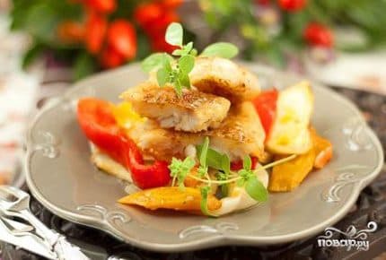 Pollock with vegetables in the oven