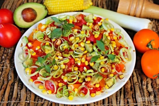 Tomato salad with avocado, corn, and leek