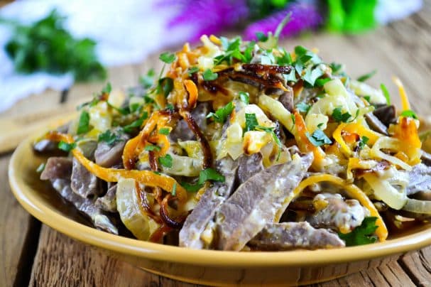 Salad with heart, carrots, and onions