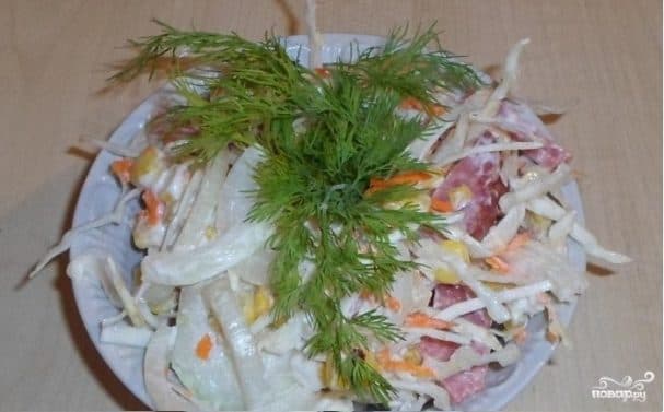 Salad with fresh cabbage and smoked sausage