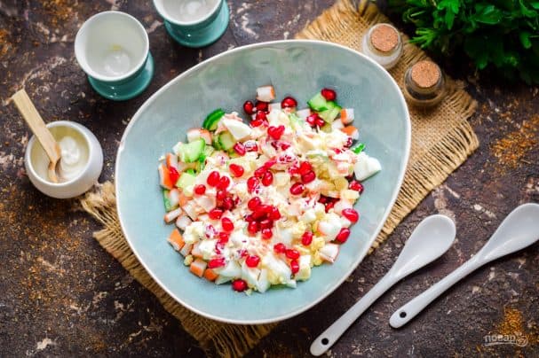 Salad with pomegranate and crab sticks