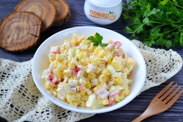 Salad with crab sticks and pineapple