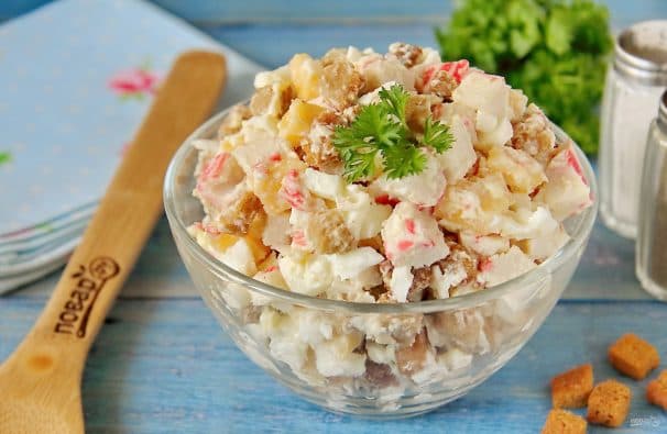 Salad with crab sticks and chips