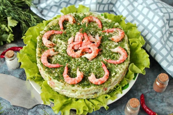 Salad with red fish and shrimp in layers