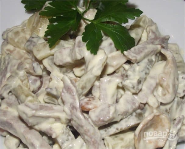 Salad with tongue and pickled cucumbers