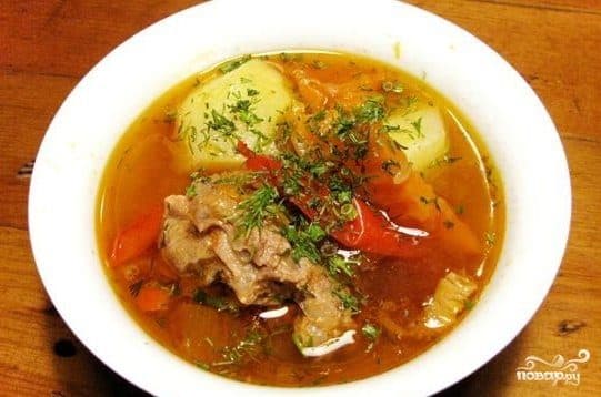 Beef shurpa cooked in a cauldron