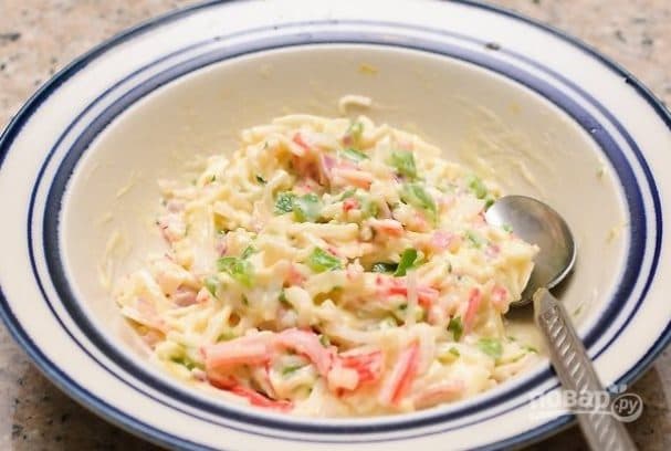 Warm salad with crab sticks