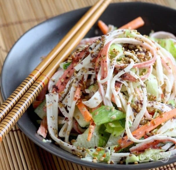 Delicious salad with crab sticks and vegetables
