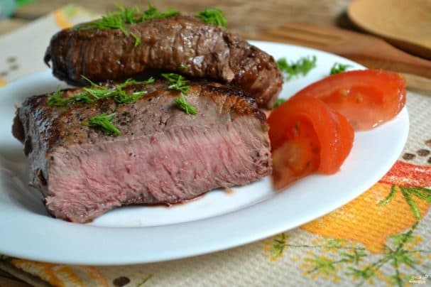 Beef steak fried in a pan